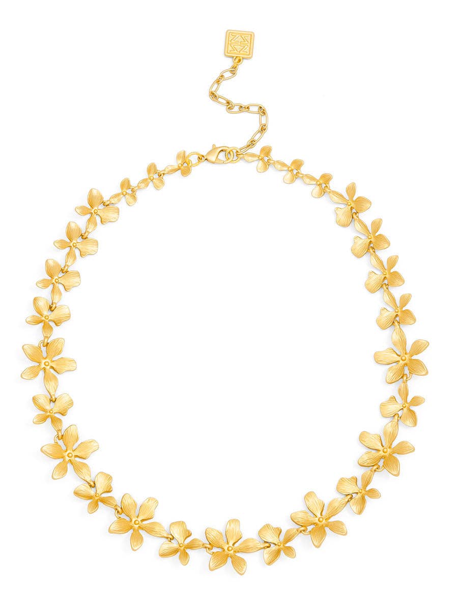 Gold floral necklace on a white background