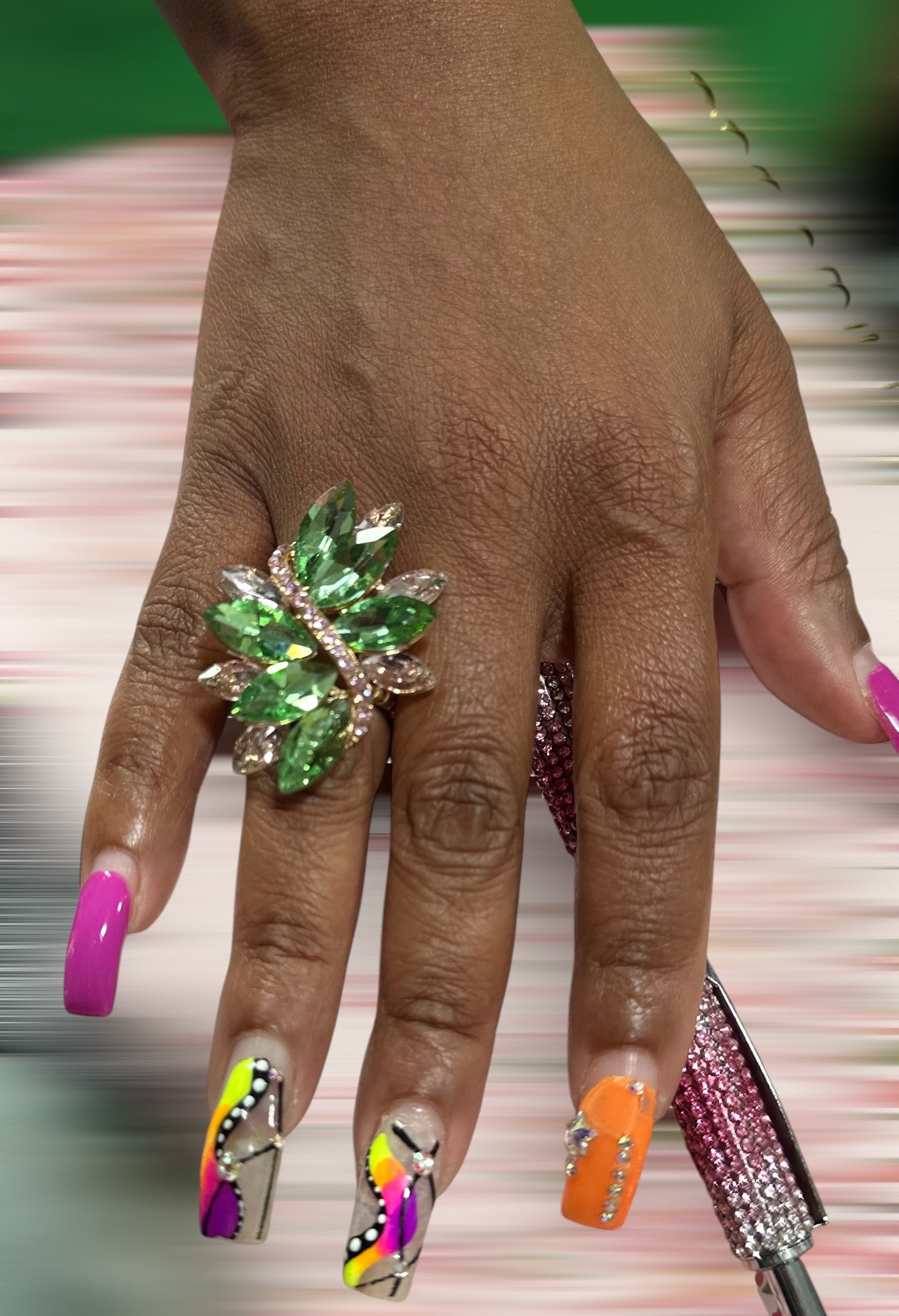 model wearing a pink and green stretch ring
