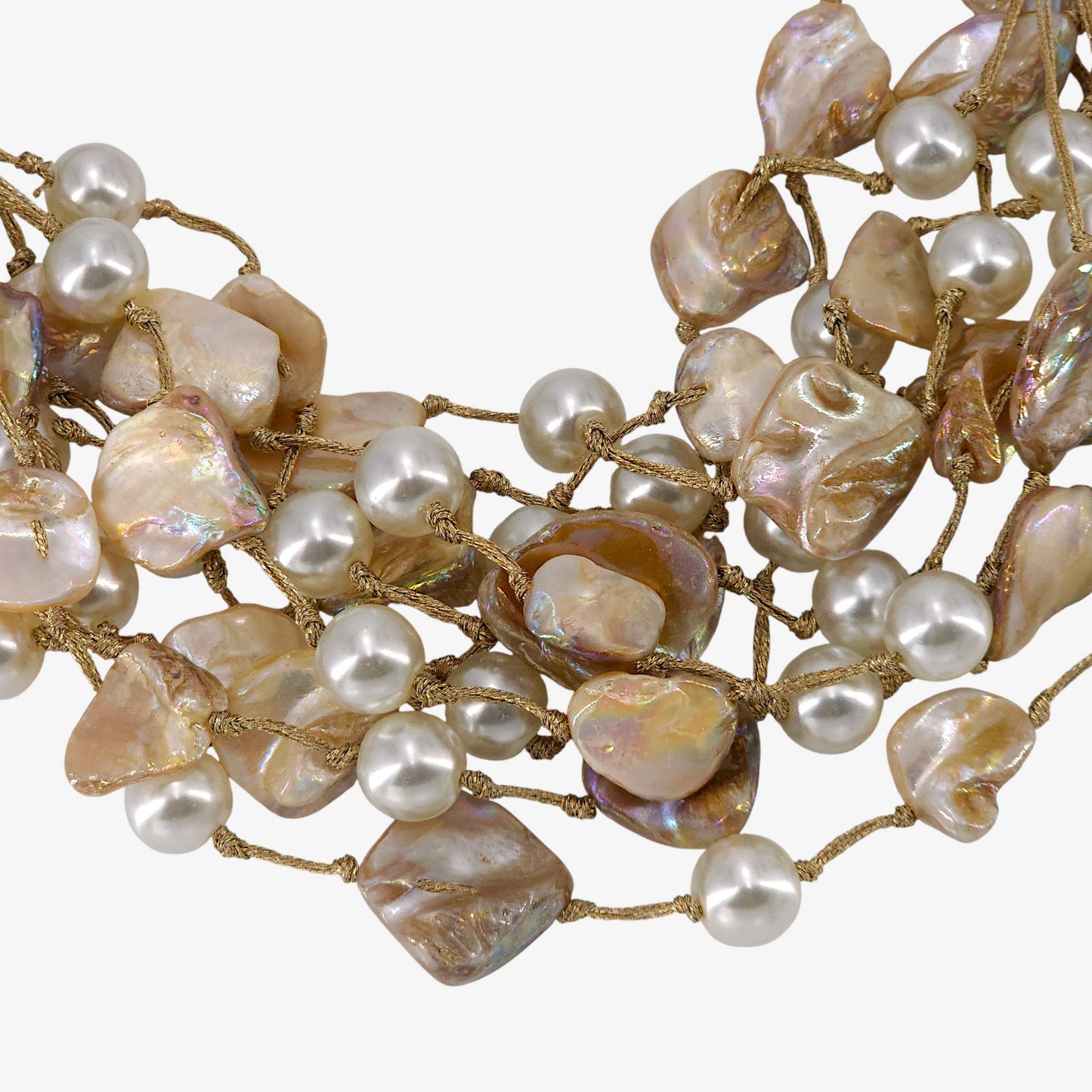 Necklace with pearls and gold wire on a white background