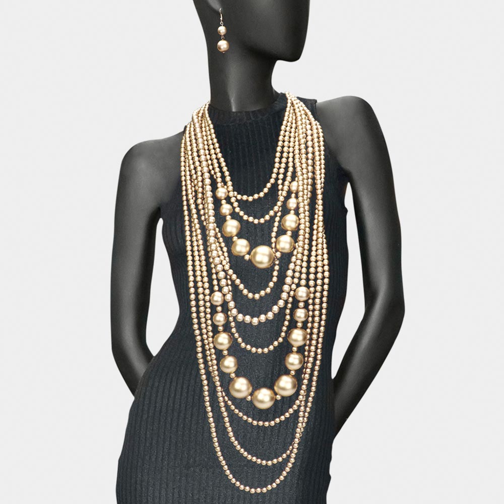 model wearing long pearl necklace