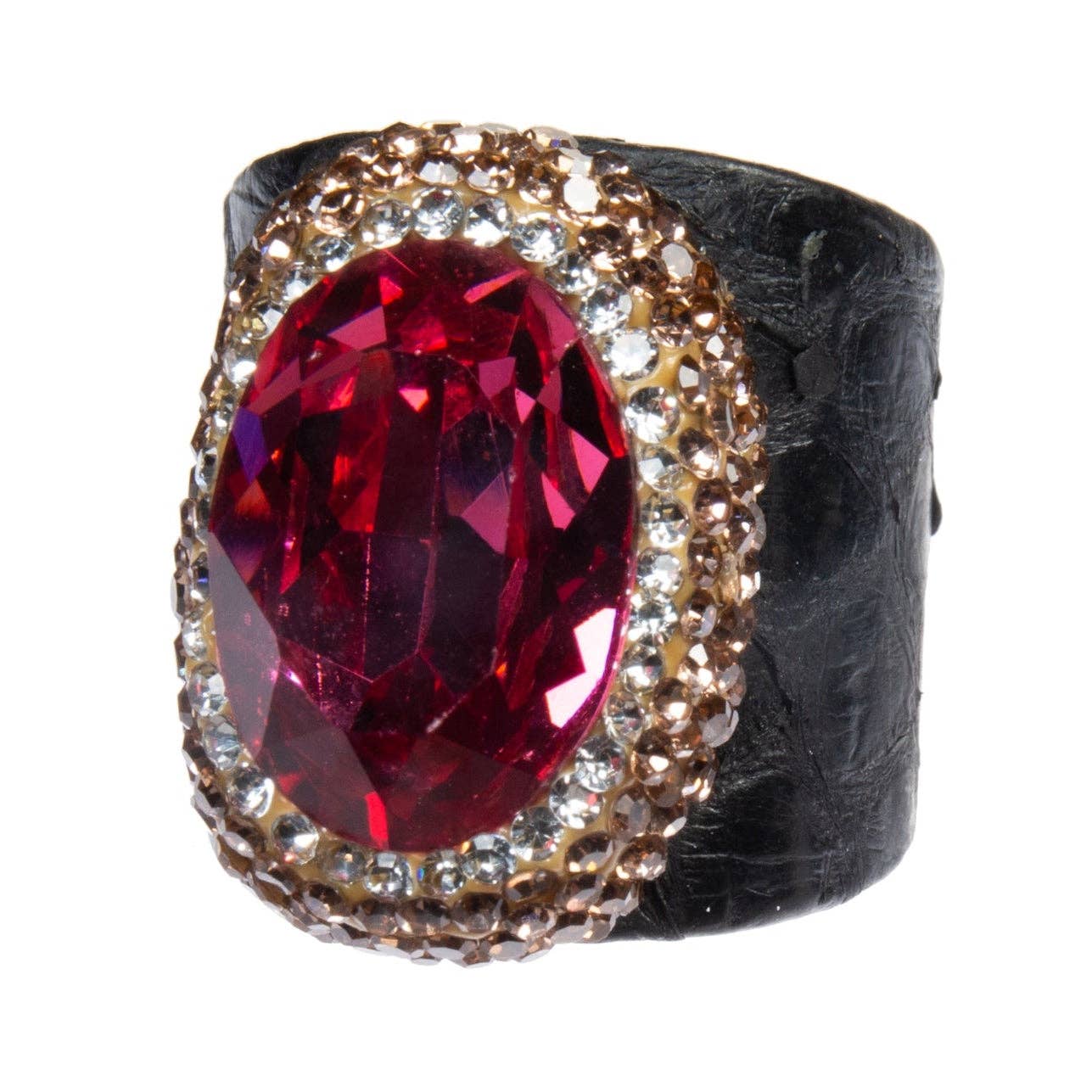 Ring with a large red gemstone and smaller diamonds on a textured black band