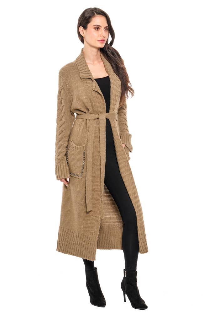 Woman wearing a long beige coat on a white background