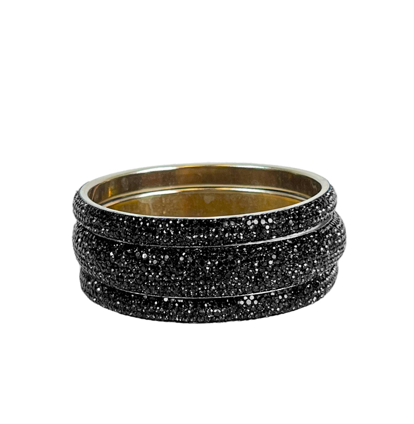 Set of black glittery bangles on a white background