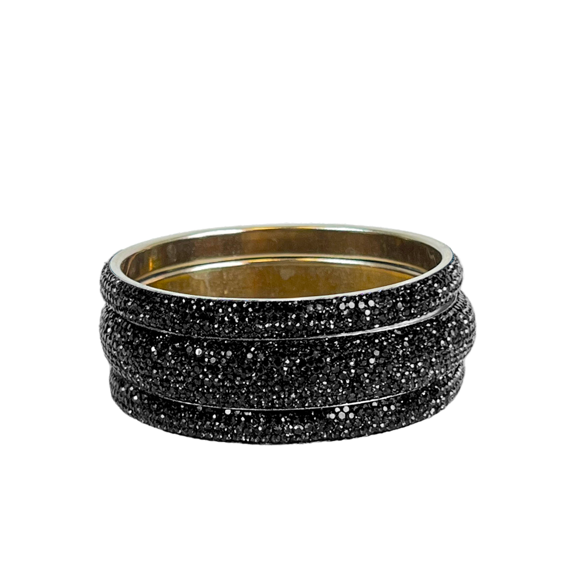 Set of black glittery bangles on a white background