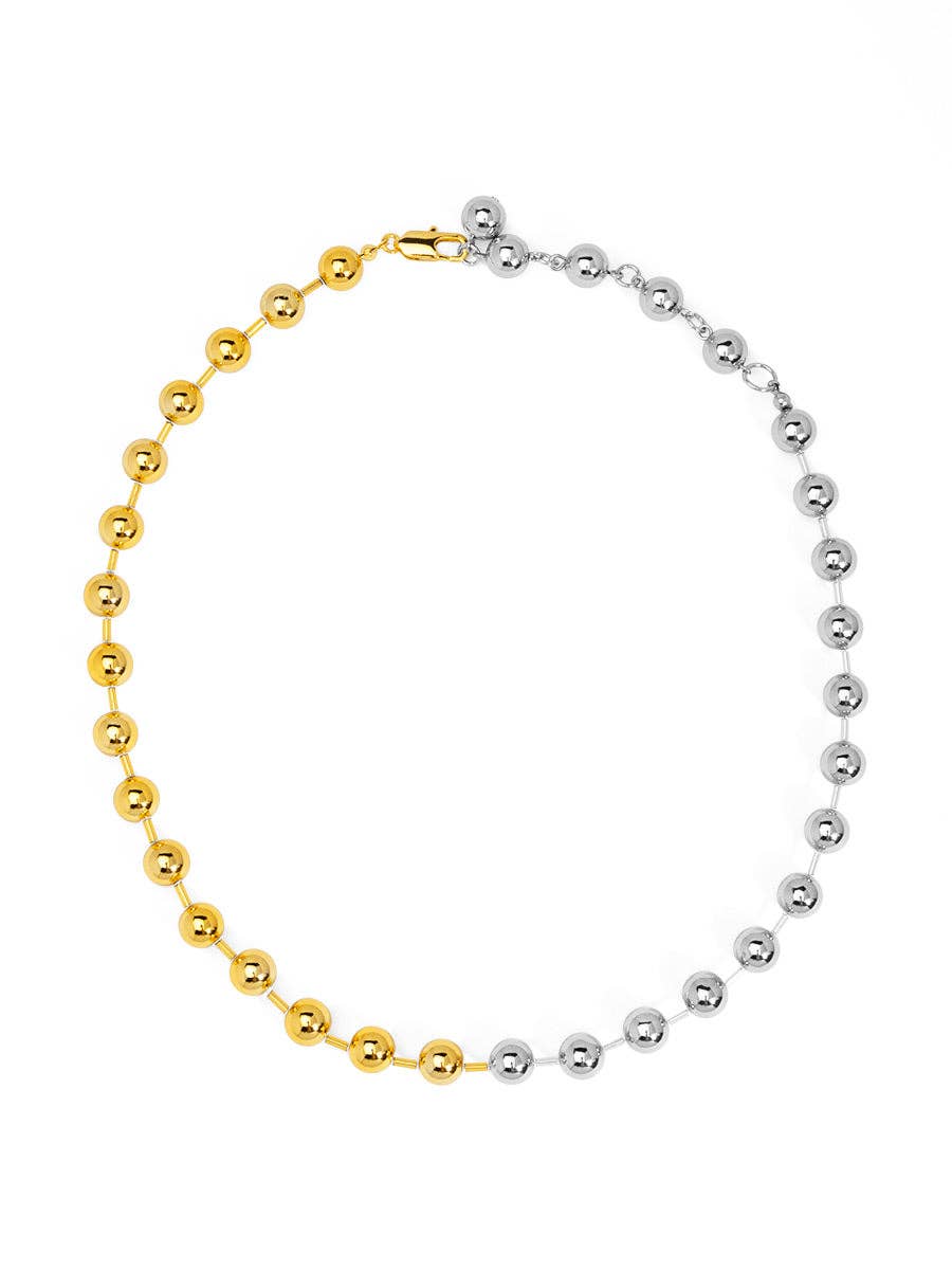 Bracelet with gold and silver beads on a white background