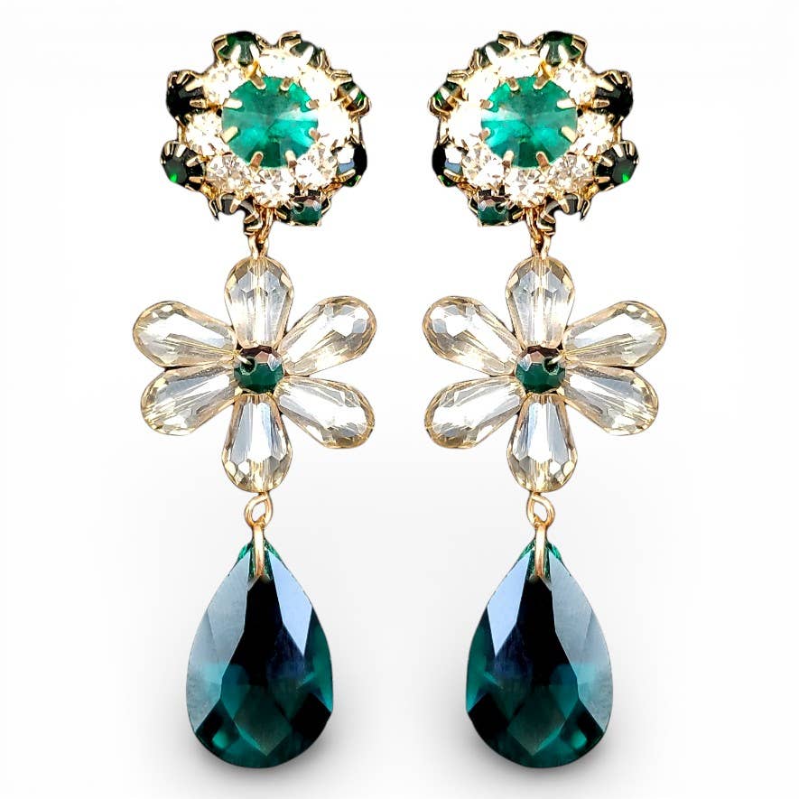 Pair of earrings with floral designs and green teardrop stones on a white background