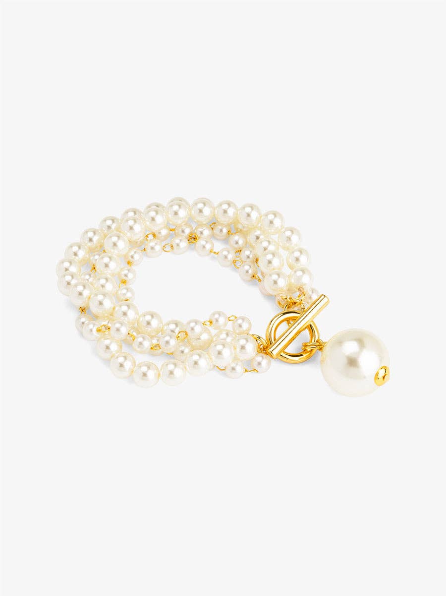 Pearl bracelet with a gold clasp on a white background