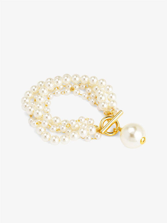 Pearl bracelet with a gold clasp on a white background