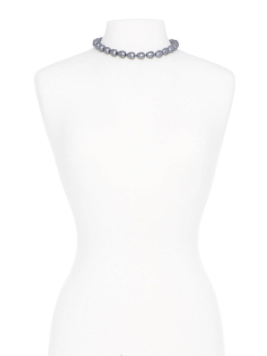 Necklace on a mannequin with a white background
