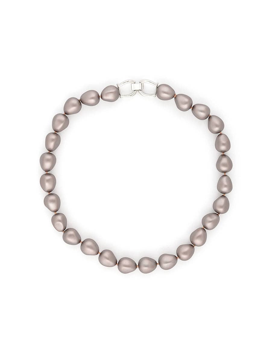 Pearl necklace with a silver clasp on a white background