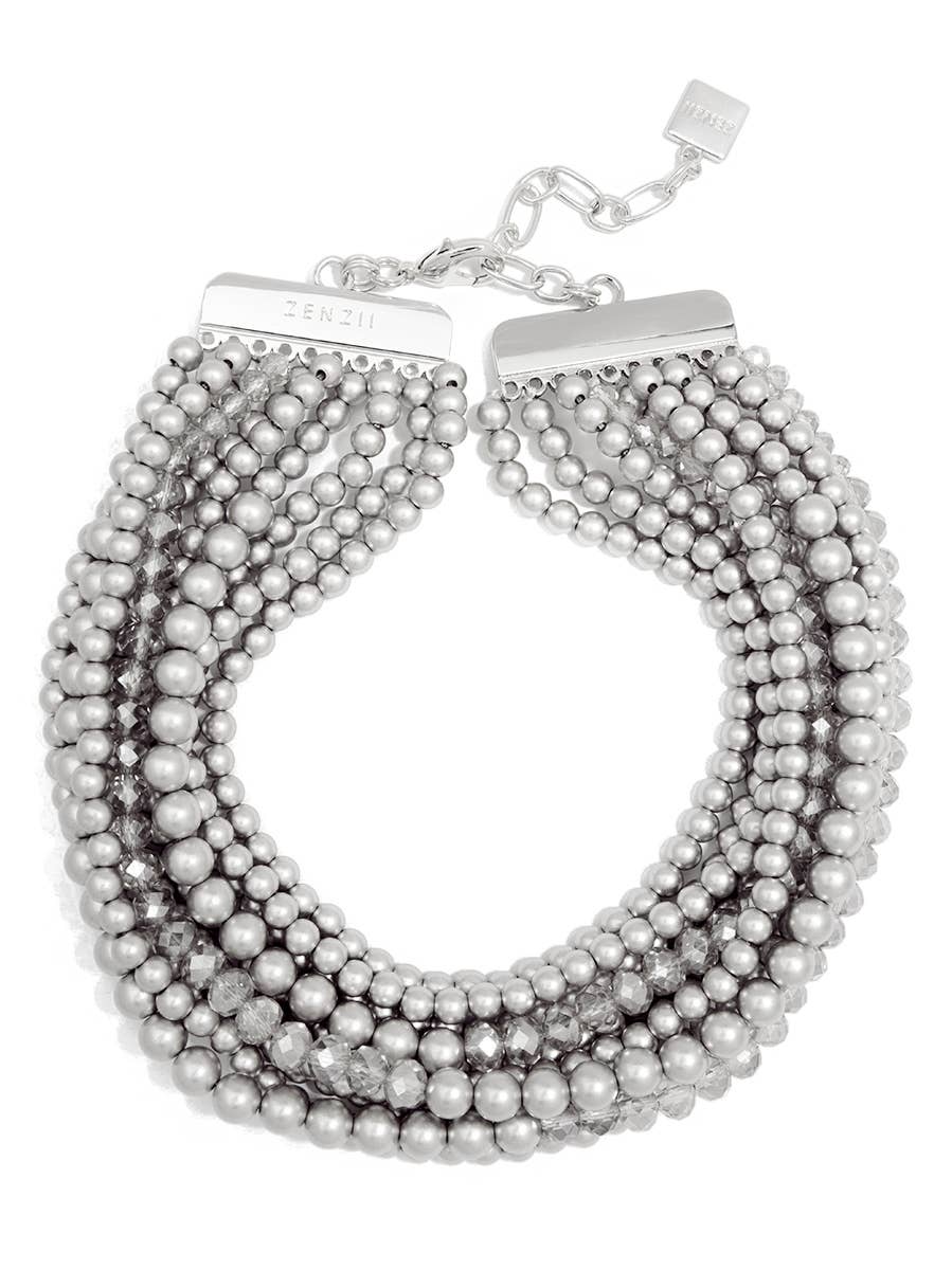 Multi-strand pearl necklace with silver clasp on a white background