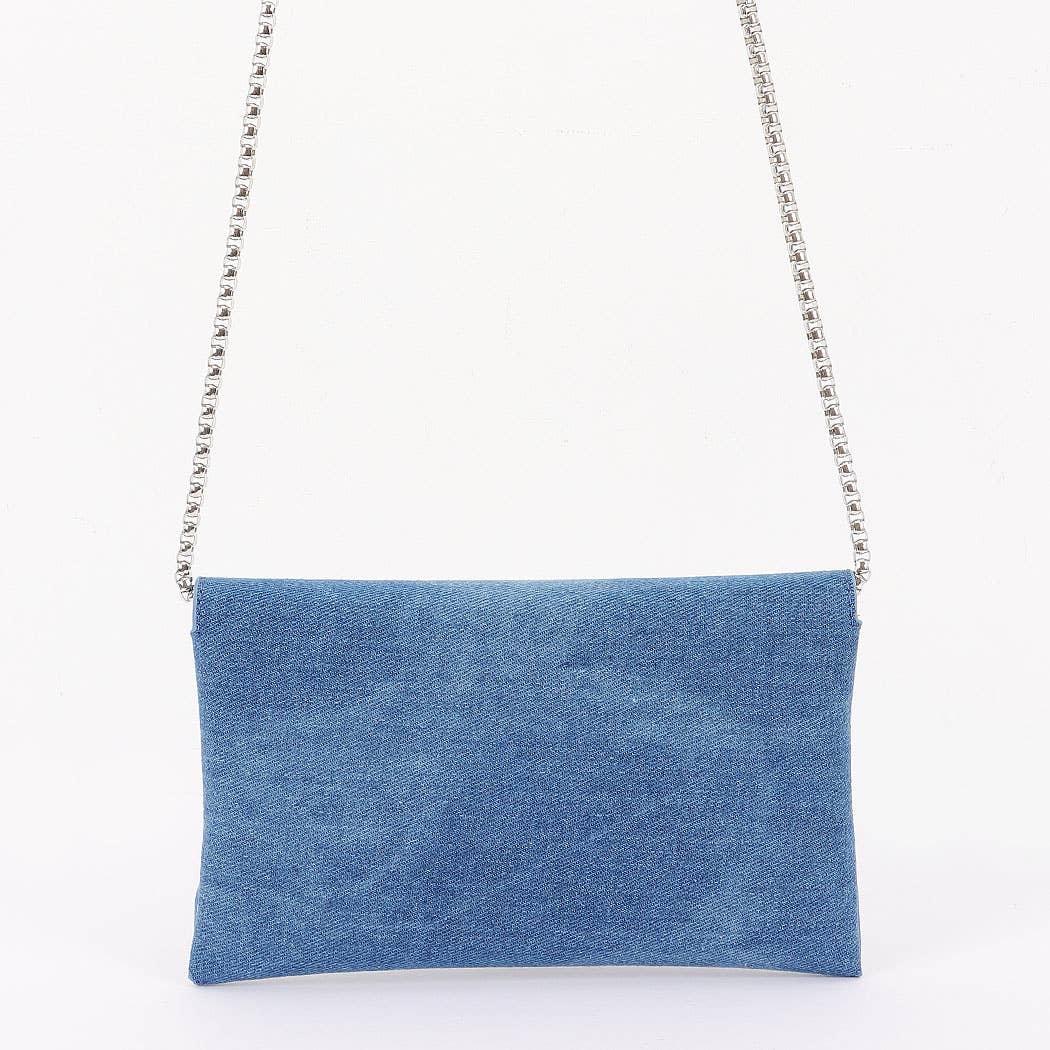 Blue clutch bag with a chain strap on a white background