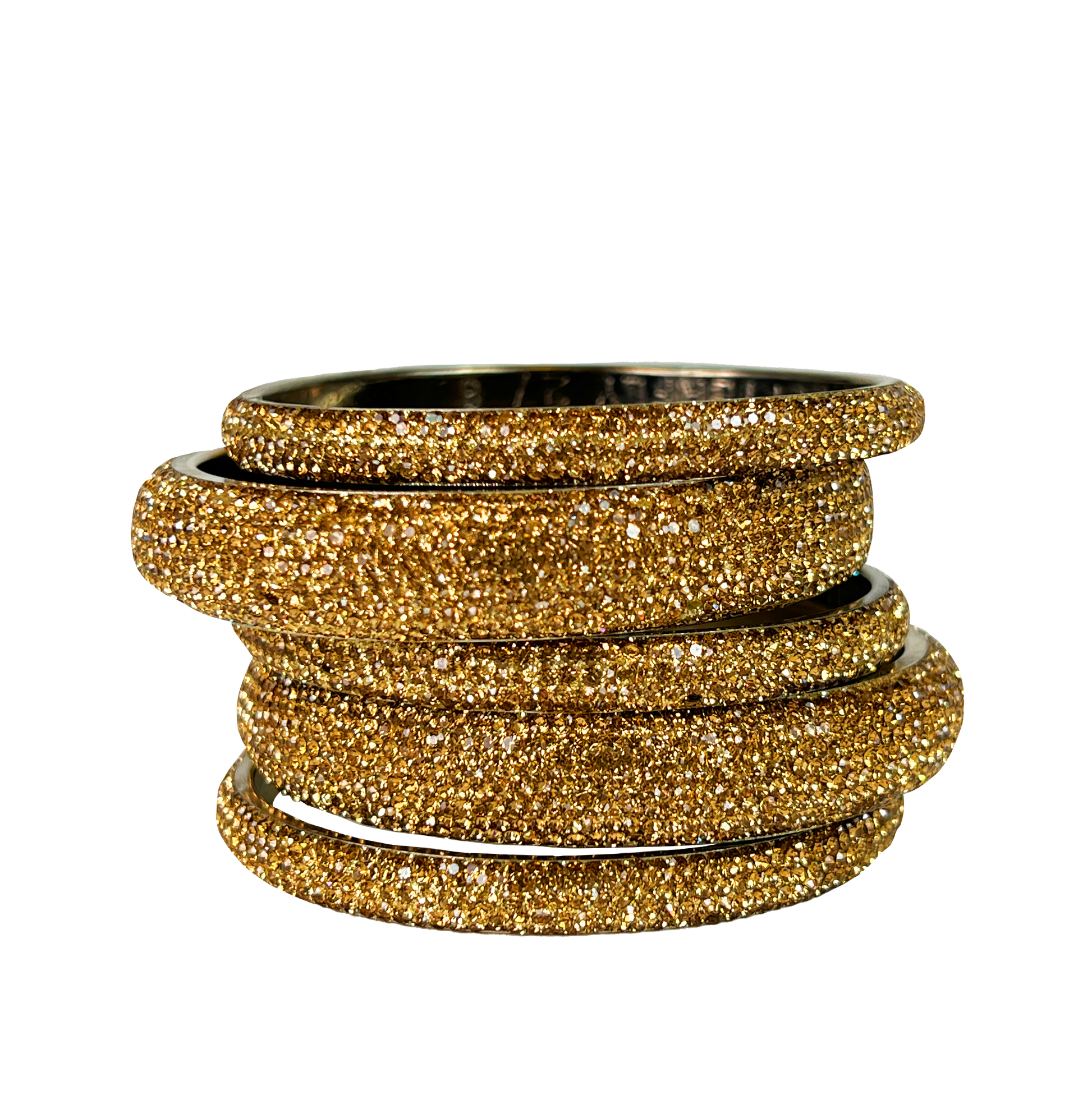 Stack of gold glittery bangles on a white background