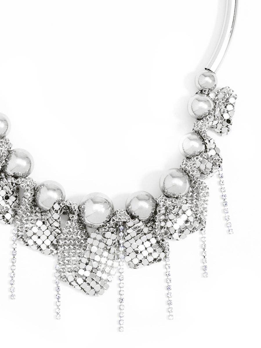 Silver necklace with pearls on a white background
