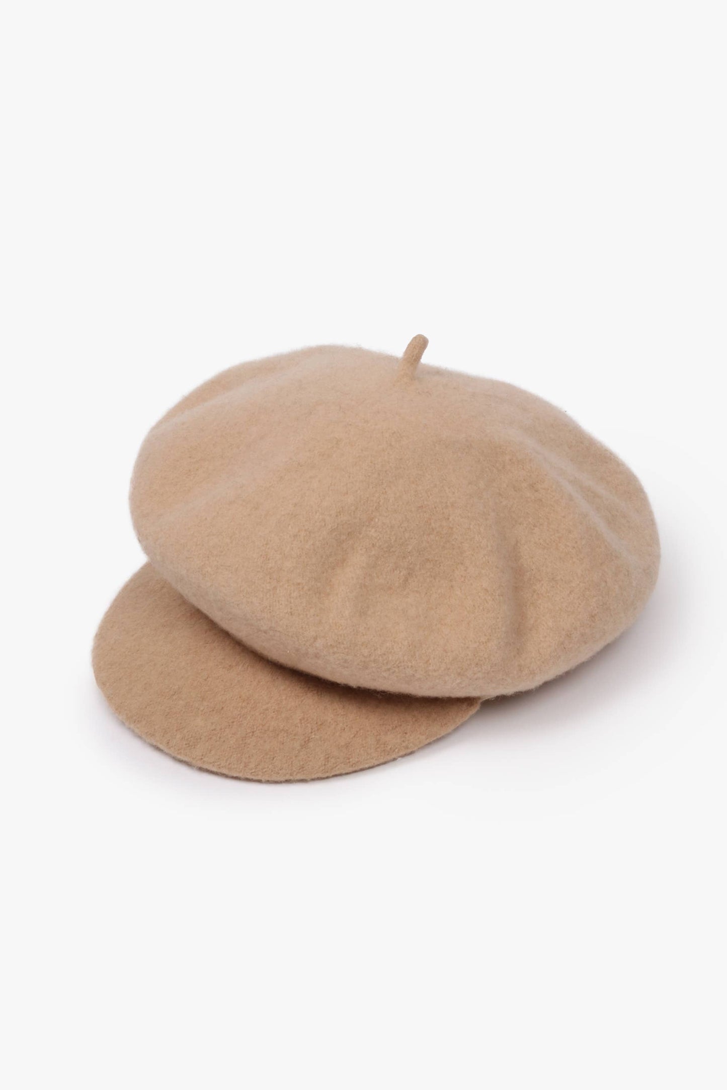 Two beige berets stacked on a white background