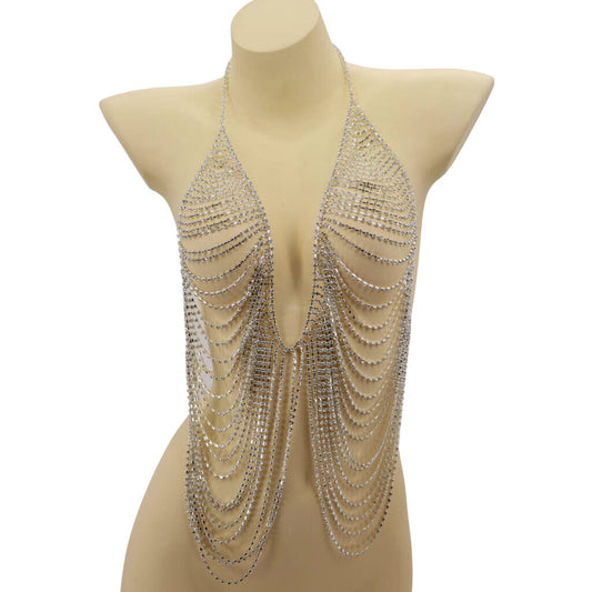 Mannequin wearing a sparkling, chain-like garment on a white background