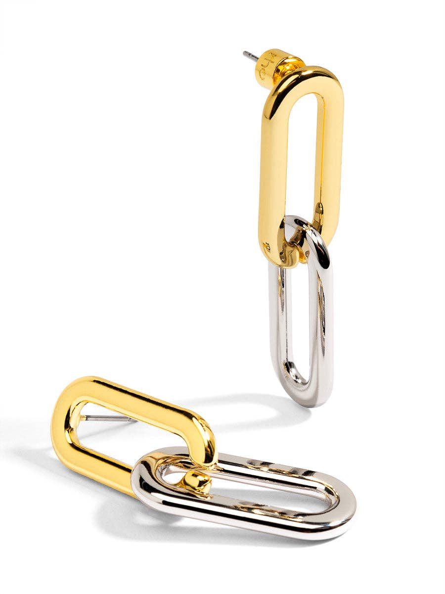 Gold and silver hoop earrings on a white background