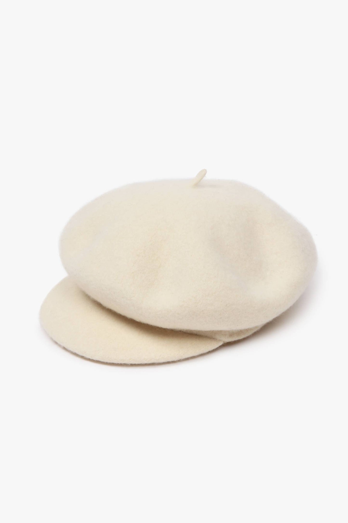 Two beige berets stacked on a white background