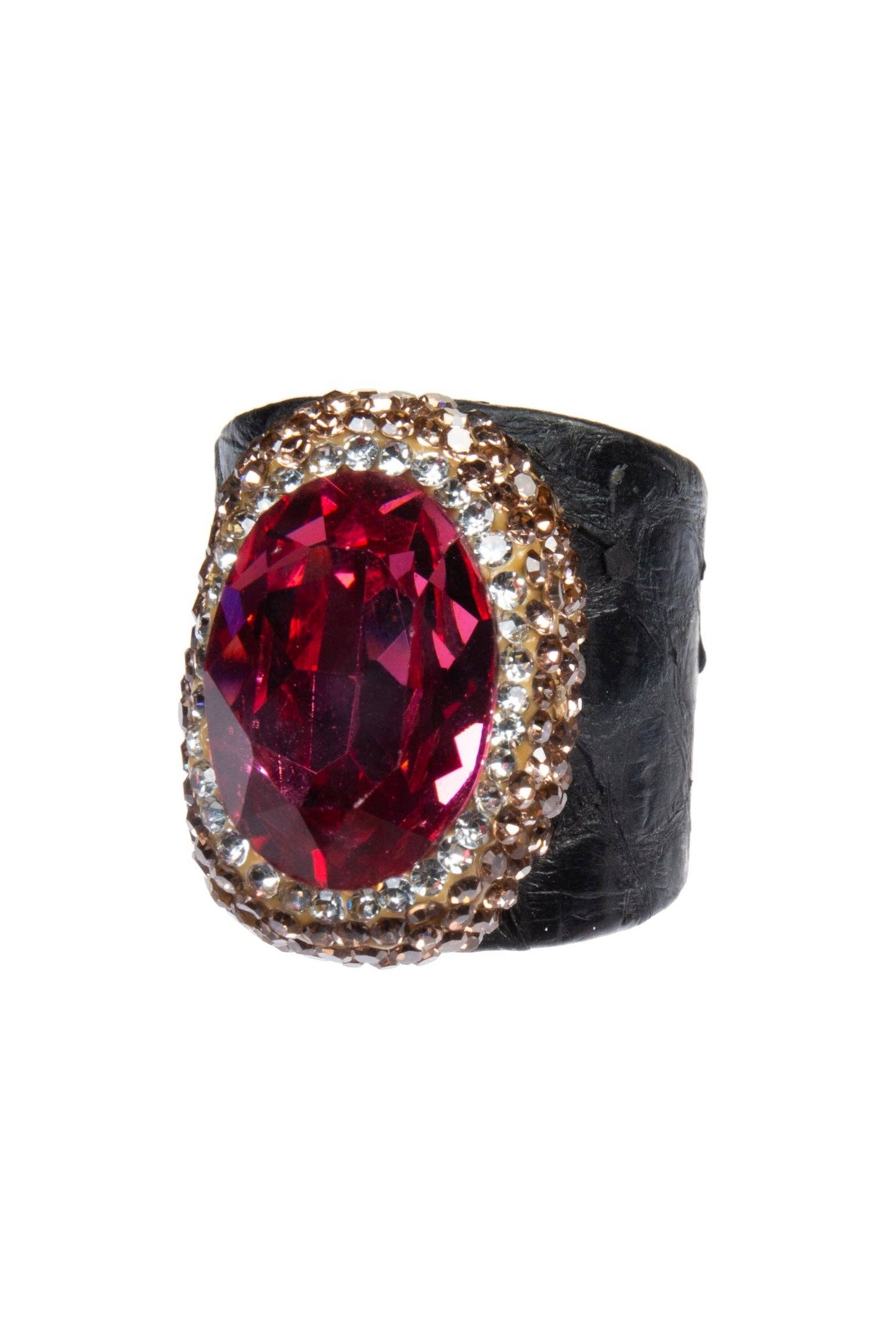 Ring with a red gemstone and gold accents on a white background