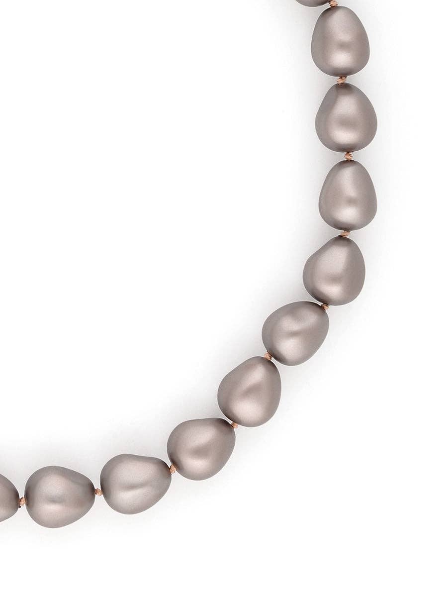 Necklace with gray pearls on a white background
