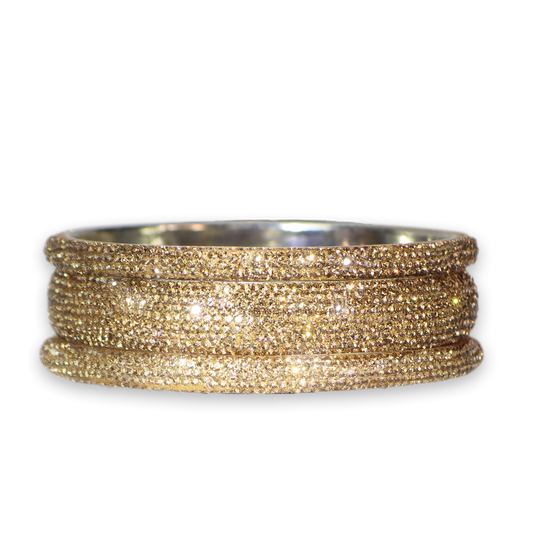 Gold bangle on a white background